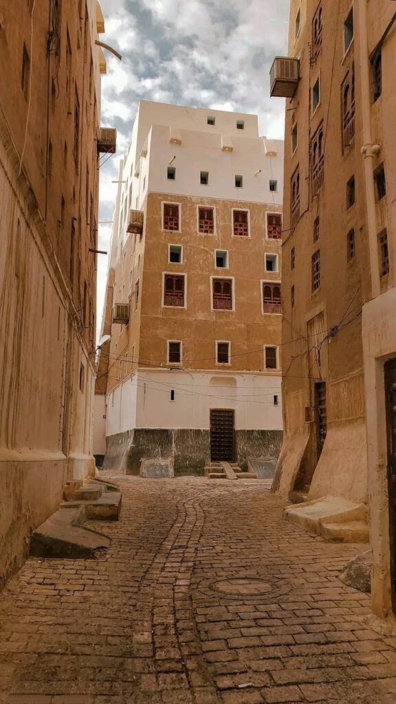 Mud-brick wall maintenance in Shibam Hadramout.